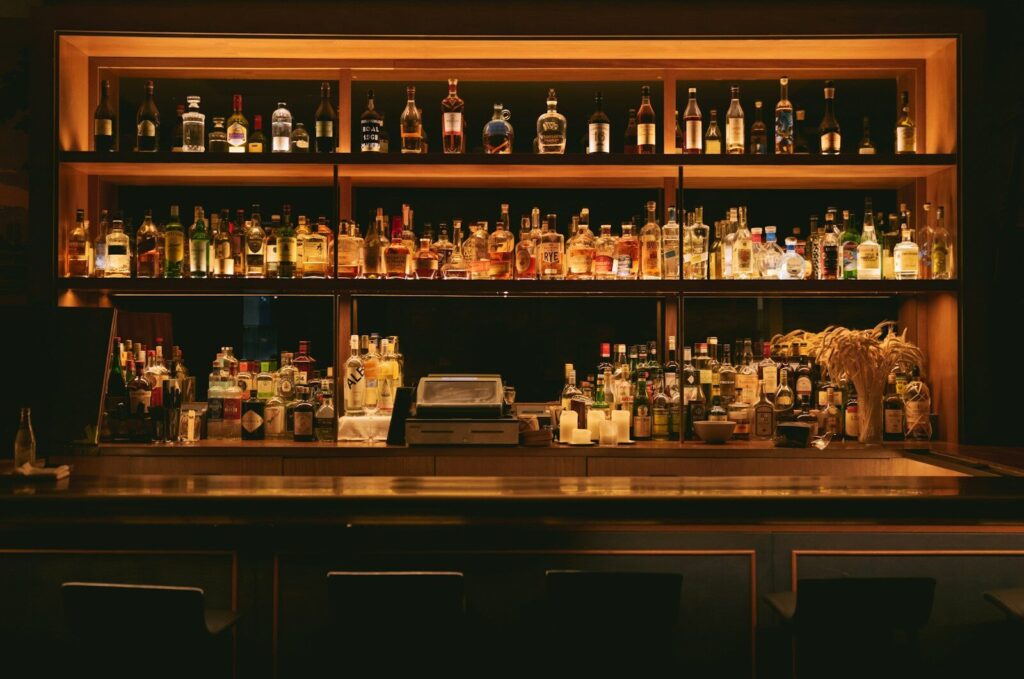 Bar & Lounge brown wooden shelf with bottles